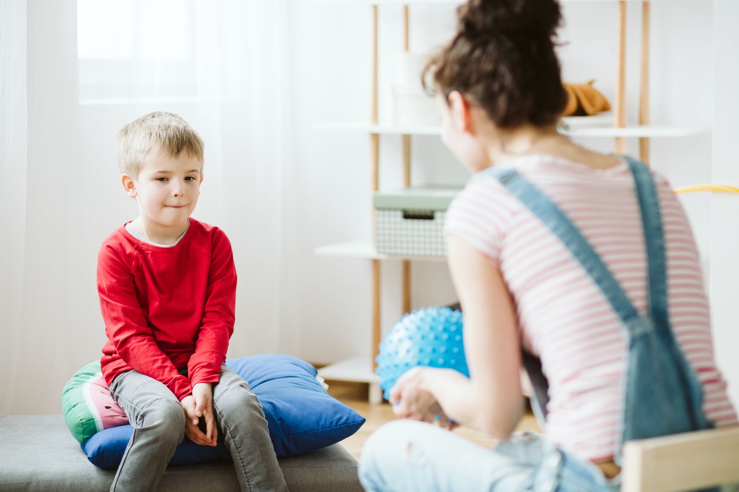 A young client talking with a therapist